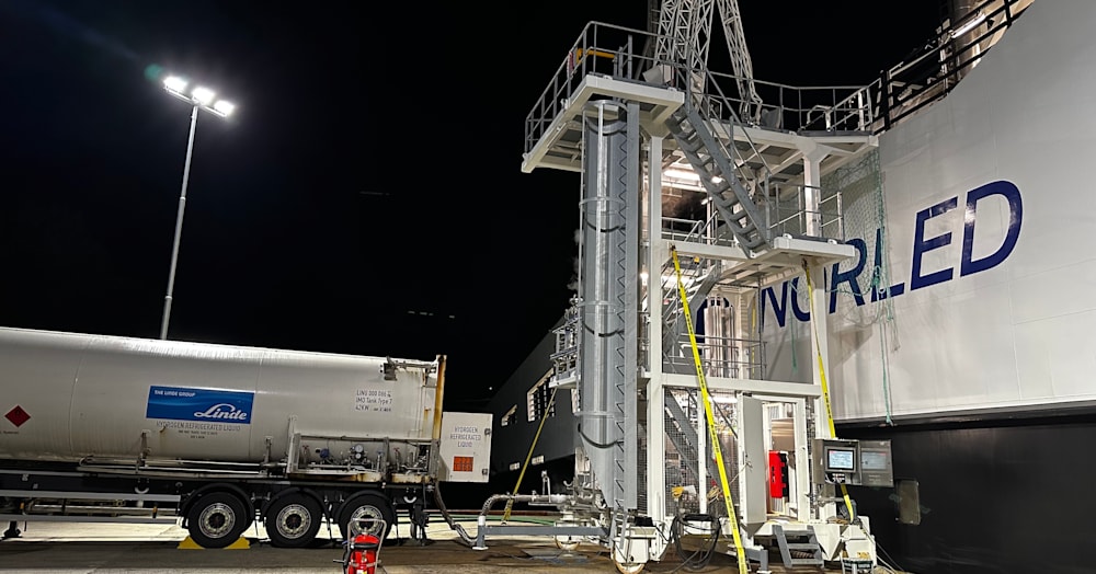 MF Hydra ferry receiving liquid hydrogen from cryogenic tanker truck at Hjelmeland, Norway